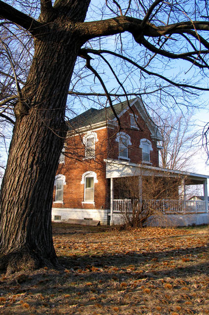 The historic Gilpin house in Dallas City, Illinois is framed by an 